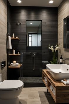 a modern bathroom with black and white decor