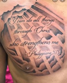 the back of a man's chest with bible verse on it