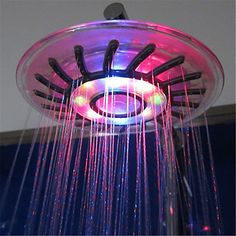 a shower head with colorful lights on it