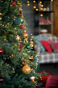 a christmas tree is decorated with ornaments and lights