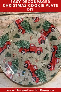 a christmas plate with red trucks and trees on it