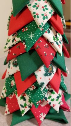 a small christmas tree made out of fabric