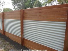 a wooden fence with white slats on it