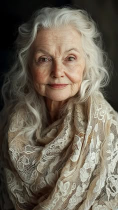 an older woman with white hair wearing a scarf