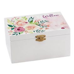 a white box with flowers painted on the side and name written in pink, yellow and green