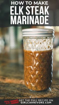 a jar filled with food sitting on top of a counter next to the words how to make elk steak marinade