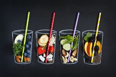 three cups filled with different types of fruits and veggies on top of each other