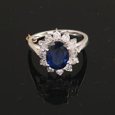 a sapphire and diamond cluster ring