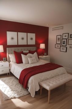 a red and white bedroom with pictures on the wall