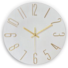 a white clock with gold numbers on it