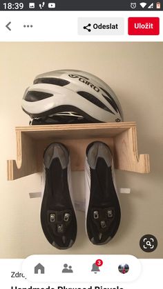 there is a pair of shoes and a helmet on the shelf