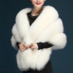 a woman wearing a white fur stole