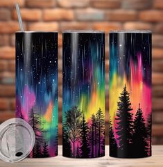 three colorful tumbles with trees and stars in the sky