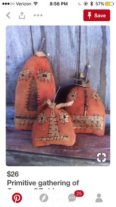 three orange pumpkins with designs on them