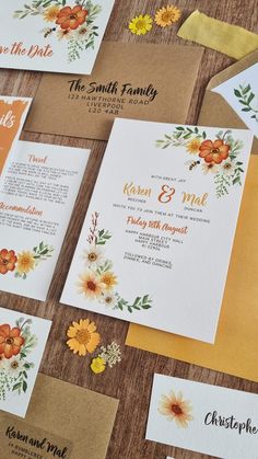 the wedding stationery is laid out on top of each other