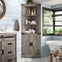 a bathroom with a sink, bathtub and wooden cabinet in the middle of it