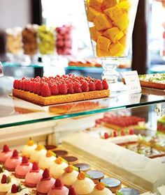 a display case filled with lots of different types of desserts