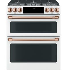 two white ovens side by side with gold knobs on the top and bottom