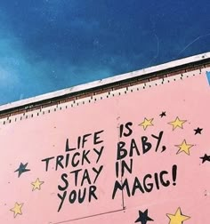 a pink sign that says life is tricky baby, stay in your magic