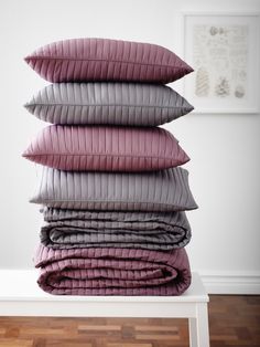 four pillows stacked on top of each other with the price tag 25 95 pers