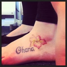 a woman's foot with a flower on it and the word shana written in cursive writing