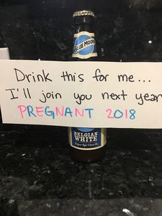 a beer bottle with a sign attached to it that says, drink this for me i'll join you next year pregnant 2013