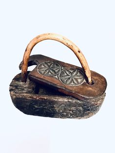 an old wooden purse with two handles