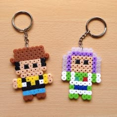 two perler keychains that have been made to look like cartoon characters