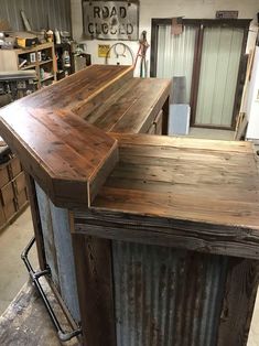 a wooden counter top sitting inside of a garage