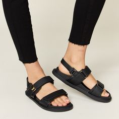 Step Up Your Summer Shoe Game With These Trendy Velcro Double Strap Slingback Sandals. The Double Strap Design With Velcro Closure Offers Both Style And Convenience, Making Them Easy To Adjust For The Perfect Fit. These Slingback Sandals Are Versatile And Perfect For Various Occasions, From Casual Outings To Summer Parties. The Supportive Yet Comfortable Design Ensures You Can Wear Them All Day Long Without Sacrificing Style. Elevate Your Warm-Weather Wardrobe With These Fashionable Velcro Doubl Black Synthetic Slingback Sport Sandals, Black Sport Sandals With Adjustable Strap For Spring, Black Slingback Sport Sandals With Adjustable Strap, Casual Black Double Strap Slingback Sandals, Black Double Strap Footbed Sandals With Adjustable Strap, Black Double Strap Slingback Sandals, Black Strappy Slingback Sandals With Cushioned Footbed, Black Synthetic Footbed Sandals With Adjustable Straps, Black Double Strap Footbed Sandals For Spring