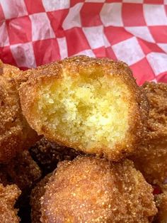 fried food item in basket with checkered paper wrapping around the top and bottom half