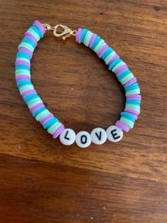 adorable bracelet that is perfect for any occasion! Tie Off A Bracelet, How To Tie Off A Bracelet, Cute Handmade Bracelets, Clay Beads Bracelet Ideas, Bracelet Pattern Ideas, Clay Bracelets Ideas, Beads Bracelet Ideas, Bracelet Making Ideas, Clay Beads Bracelet