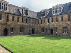 an old building with grass in front of it