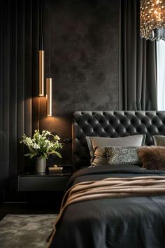 a bedroom with dark walls and black bedding