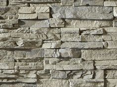 a stone wall that is made out of different types of rocks