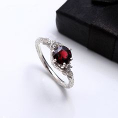 RING DETAIL Metal : 925 sterling silver Center stone : Garnet size of stone : 7mm shape : Round About gems stone GARNET . Garnet have exceptional characteristics to satisfy a wide range of vigorous needs--from improving one's essentialness and wellbeing to insurance from pessimism. Since it's such a stimulating stone, garnet is regularly utilized for appearance purposes and worn as a charm for best of luck. Notwithstanding bringing essentialness, high energy, and insurance, garnet additionally h Garnet Ring With Prong Setting, Garnet Open Ring Promise Ring, Elegant Sterling Silver Ruby Open Ring, Elegant Sterling Silver Open Ruby Ring, Elegant Garnet Jewelry For Proposal, Elegant Garnet Crystal Round Ring, Garnet Open Ring For Anniversary, Elegant Round Garnet Crystal Ring, Wedding Garnet Solitaire Rings