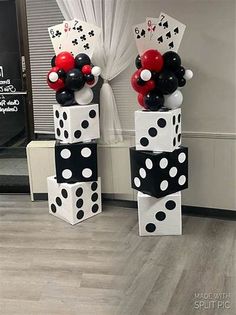 two black and white dices with balloons on them