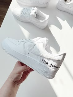 someone is holding up their white nike air force 1 sneakers with the words miss fabulous written on them