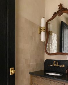 a bathroom with a sink and mirror in it