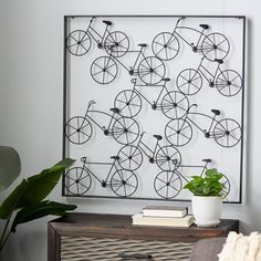 a living room with a bicycle artwork on the wall