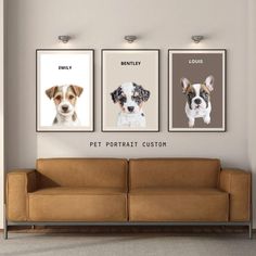 three dogs are hanging on the wall above a couch