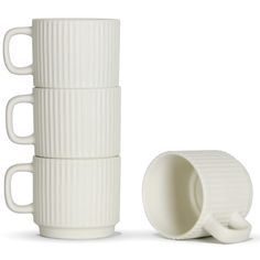 four white cups stacked on top of each other