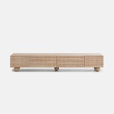 the sideboard is made from wood and has four drawers