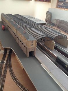 a model train station with trains on the tracks