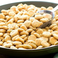 a close up of a bowl of food with a spoon in it on a table