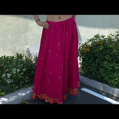 Designer. Unique Skirt For Women Of Today Add Class And Elegance. Stand Out In This Pink/Orange Long Skirt, Gold Details Overall, Pure Cotton Fabric For That Breathable Comfort . Wear It With Crop Tops, Bodysuits And Go On A New Adventure ! It Will Never Go Out Of Style. Size Fits Small To Large With The Tie String ! Belly Dance Tiered Skirt For Festivals, Traditional Long Wrap Skirt For Spring, Summer Bohemian Lehenga For Festive Occasions, Bohemian Summer Lehenga For Festive Occasions, Bohemian Summer Festive Lehenga, Summer Festival Bollywood Style Lehenga, Summer Festival Bollywood Lehenga, Bollywood Style Summer Festival Lehenga, Bollywood Style Lehenga For Summer Festivals