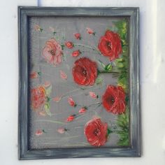 a painting of red flowers on a gray background