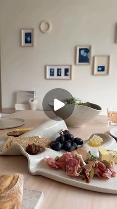 a table topped with plates and bowls filled with different types of food on top of it