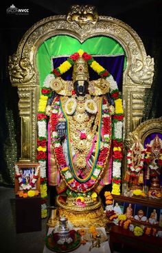 the statue of lord ganesh is surrounded by other decorations