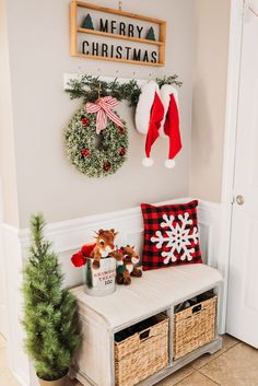 a bench with christmas decorations on the wall